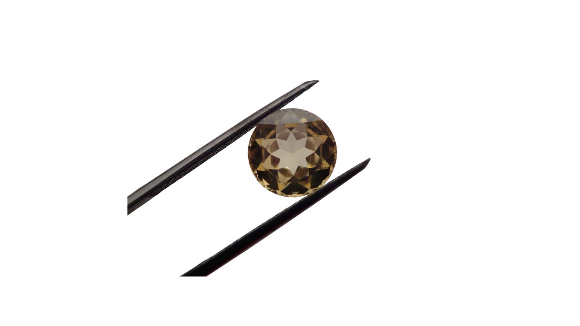 Landing A round cut gemstone held with tweezers